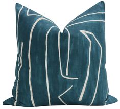 a teal pillow with white lines on the front and back, sitting on a white background