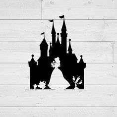 the silhouette of a castle on a wooden wall