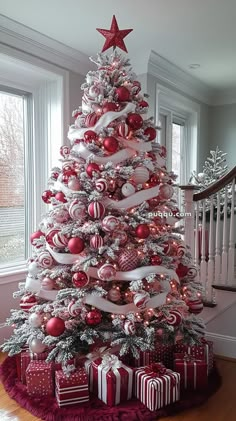 a decorated christmas tree with red and white ornaments