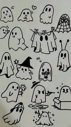 a bunch of ghost stickers that are on a paper sheet with some black and white ink