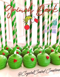 green cupcakes with red hearts and candy sticks