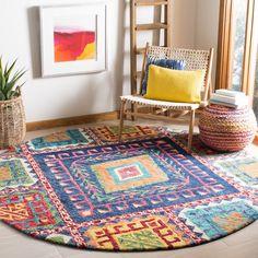 a brightly colored rug in the corner of a room with a wooden chair and potted plant