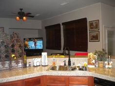 the kitchen counter is clean and ready to be used for cooking or watching tv in