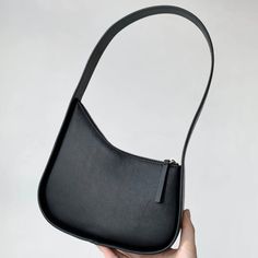 42991072936092 Black Hobo Bag With Phone Bag For Office, Minimalist Black Shoulder Bag With Mobile Phone Holder, Minimalist Black Crossbody Baguette Bag, Minimalist Black Baguette Crossbody Bag, Chic Black Hobo Bag With Mobile Phone Pocket, Trendy Black Baguette Bag For Daily Use, Black Handheld Baguette Bag For Daily Use, Black Shoulder Bag With Single Handle For Everyday Use, Black Trendy Baguette Bag For Everyday Use