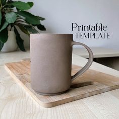 a coffee cup sitting on top of a wooden tray