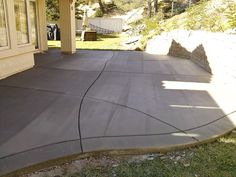 an outdoor patio with concrete walkway and steps