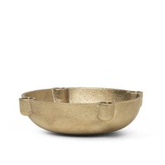 a gold metal bowl on a white background