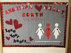 a bulletin board that says, american heart month i love you hearts and two people holding hands