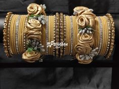 "Elegant and trendy, it makes your complete attire look so amazing. These bangles are an \"All Occasion Jewellery\". Be it a festival or a party or an outing, these bangles always enhance your personality. Keep away from fire and corrosive liquids." Bohemian Wedding Bracelets With Flower Shape, Adjustable Flower Bangle For Wedding, Adjustable Flower-shaped Bangle For Weddings, Festive Gold Jewelry With Flower Decoration, Yellow Bracelets For Wedding And Festivals, Yellow Wedding Bracelets For Diwali, Yellow Bracelets For Party And Festivals, Yellow Wedding Bracelets For Festivals, Bridal Chura