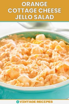 an orange cottage cheese jello salad in a blue bowl with the title above it