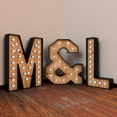 the word ms and l is made up of wooden letters with light bulbs on them