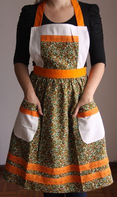 a woman wearing an apron with pockets on both sides