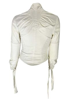 For Sale on 1stDibs - TheRealList presents: a white cotton Gucci blouse designed by Tom Ford. From the Fall/Winter 2003 collection, this beautiful top features quilted details Fitted Gucci Blouse For Fall, Gucci Long Sleeve Blouse For Fall, Gucci Fitted Tops For Spring, Elegant White Gucci Top, Fitted Gucci Tops For Spring, Gucci Fitted Blouse For Spring, Elegant Fitted Gucci Tops, Gucci Cotton Tops For Spring, Designer Gucci Tops For Spring