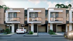 a car parked in front of two story townhouses