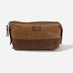 This personalized dopp kit is a must for his next adventure. Take this rugged toiletry bag fishing, hunting, camping or on your next vacation! This brown bag is made of durable waxed canvas, genuine leather and has a classic striped lining. It also features a spacious interior and an easy-to-access top zipper. Measuring 12 inches by 6 inches, this toiletry bag makes the perfect men's gift for Father's Day, groomsmen, graduation and more! ​Props are not included with the purchase of this Pe Brown Waxed Canvas Bag For Camping, Rectangular Brown Camping Bags, Luggage Bags Travel, Marley Lilly, Dopp Kit, Brown Bag, Waxed Canvas, Brown Bags, Perfect Man