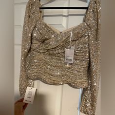 Perfect For Nights Out And Holidays. Tag Says Us 10 So It’s L But If You’re In Between Size M & L This Will Fit You As Well. Never Worn, Full Tags, Completely New. I Paid Over $400 Including Taxes, Make Me An Offer! Long Sleeve Tops For Wedding Party Season, Long Sleeve Tops For Wedding And Party Season, Fitted Tops For Fall Wedding, Long Sleeve Sequin Tops For Wedding, Fitted Fall Wedding Tops, Long Sleeve Sequined Wedding Top, Elegant Holiday Blouse For Date Night, Pleated Top Blouses, Satin Wrap Blouse