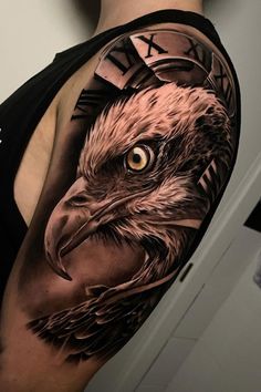 an eagle tattoo on the arm with clock and roman numerals around it's face