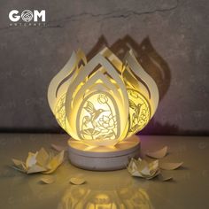 a paper lamp that looks like an origami lotus