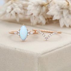 Experience a twist of elegance with our unique Marquise Cut Natural White Opal Ring Set in Rose Gold. It's a symbol of sophistication and beauty White Opal Ring, Twist Ring, Rose Gold Engagement, Affordable Jewelry, Opal Ring, Marquise Cut, Gold Engagement, White Opal, Opal Rings