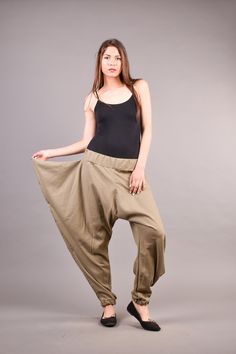 "Linen Harem Pants, Harem Trousers, Baggy Pants, Loose Pants. Extravagant harem trousers with interesting and unusual cut. The baggy pants are loose fit and feature drop crotch. The model is made of linen fabric so it is extremely comfortable women pants suitable for the daytime. If you are looking for the perfect addition to your casual outfit these loose pants are a great choice matched with flats or sneakers. ^ Sizes: The item can be made in sizes from XXS to 7XL. Please, use the size chart b Baggy Full-length Khaki Bottoms, Baggy Khaki Bottoms, Casual Baggy Yoga Trousers, Baggy Wide Leg Khaki Bottoms, Baggy Wide Leg Khaki Pants, Baggy Khaki Straight Pants, Summer Stretch Drop Crotch Pants, Baggy Full-length Harem Pants With Pockets, Baggy Full-length Khaki Parachute Pants