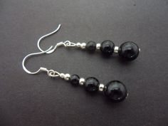 This a pair of black onyx bead earrings with 925 solid silver hooks. Measure approx. 4cm from top of hook to bottom of earring. Freshly made by me and unworn. Thanks for looking!! Nickel-free Black Beaded Drop Earrings, Gift Black Sterling Silver Beaded Earrings, Nickel Free Black Round Bead Earrings, Black Drop Earrings With French Hook, Black Beaded Round Earrings, Onyx Bead, Jade Beads, Teardrop Earrings, Black Onyx