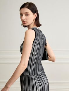 This is yyiam’s sophisticated striped sleeveless knit top allows for a cheerful yet elegant look with its stripe pattern. Thanks to its fabric's elasticity, it offers comfortable wear. It's versatile, suitable for wearing alone or layering with other items.- Ideal for daily wear- Can be paired with various styles of bottoms to create different looks- Its unique design makes it easy to match with any outfit, adding a stylish touch Sleeveless Knit Top, Sleeveless Knit, Stripes Pattern, Knit Top, Daily Wear, Unique Design, Layering, Unique Designs, Knitting