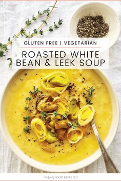 a bowl of roasted white bean and leek soup with a spoon next to it