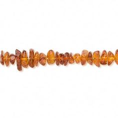 an orange beaded bracelet on a white background