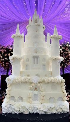 a large white cake sitting on top of a table