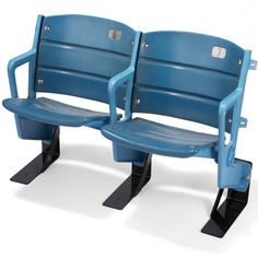 two blue seats sitting side by side on top of each other in front of a white background