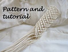 a white crocheted tassel with the words pattern and tutor written below it