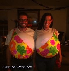 two people dressed up in costumes and posing for pictures