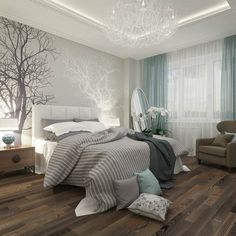 a bedroom with wood flooring and white walls has a tree painted on the wall