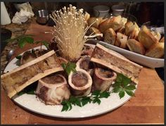 an assortment of meats and bread on a plate