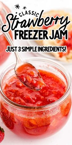 strawberry freezer jam in a glass jar with a spoon