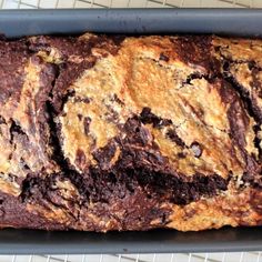 a loaf of chocolate chip bread on a cooling rack