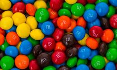 many different colored candies with the letter m on them