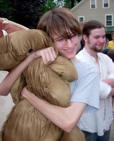 a man in a costume hugging a woman