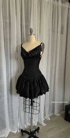 a mannequin with a black dress on it