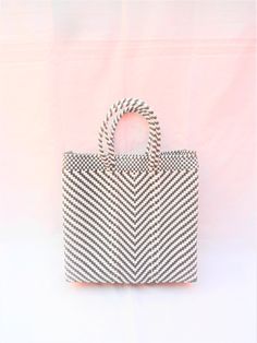 "This woven bag is made of thick and resistant plastic. Black and white color. In Mexico it is used to make purchases and that's is called 'Market bag' either 'The grocery bag'. The measurement could vary from bag to bag, because they are handmade, but this bag has the following measures aproximately : wide 12 \"(31cm) high 11\" (28cm) deep 3.5\" - 4 1/2\" (9cm) short handles 5 \"(13cm) To see more handwoven bags: https://www.etsy.com/listing/572358695/oaxacan-handwoven-plastic-tote?ref=shop_hom White Square Woven Crochet Bag, White Woven Square Crochet Bag, White Square Crochet Bag With Woven Details, White Square Crochet Bag With Braided Handles, White Woven Square Straw Bag, White Handwoven Square Shoulder Bag, Eco-friendly White Handwoven Bags, Rectangular White Beach Bag For Shopping, Daily Use White Woven Straw Bag