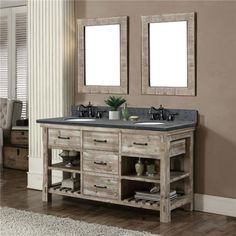 a bathroom vanity with two mirrors above it