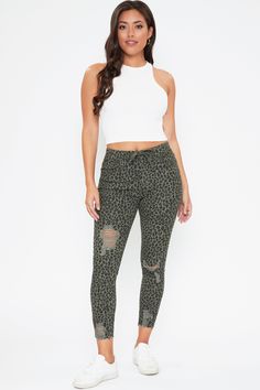 It’s time to spice it up in our Junior High-Rise Distressed Ankle Jogger! These easy-wearing pants bring your sporty looks to a whole new level. Featuring light distressing and a frayed hem to add some sporty-spice. Made with advanced stretch and a drawstring waistband for the most comfortable fit. For a sexy look- pair these with a bodysuit and heels, or wear more casual with a tank and sneakers. Product Details- High-Rise - Drawstring Waistband - 5 Pocket Construction - Front Distressing - Fra Casual Stretch Bottoms With Holes, Ymi Jeans, Sporty Looks, Spice It Up, Denim Joggers, Camo Colors, Olive Color, Feature Light, Drawstring Waistband