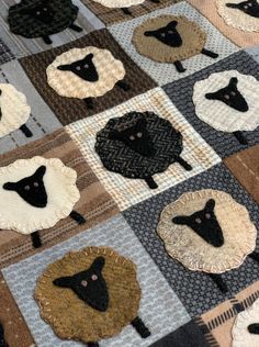 black sheep on brown and white squares are quilted onto the tablecloth with different colors