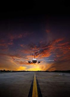 an airplane is taking off into the sunset