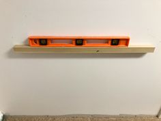 an orange object is mounted on the wall