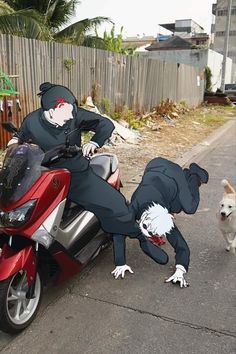 a person on a motor bike with a dog standing next to it in the street