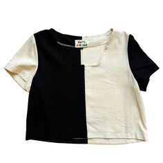 This modern black and cream color blocked patchwork top from Ersa Fibers features a square neckline, short sleeves, loose fit, and slightly cropped length. Its loose fit makes it ideal for layering to be worn year round and its bright bold design and clean lines make it a go-to statement piece. Made in Portland, Oregon Short Sleeve Patchwork Top In Contrasting Colors, Contrast Patchwork Short Sleeve Top, Modern Cotton Color Block Tops, Casual Color Block Short Sleeve Crop Top, Modern Black Crop Top For Summer, Summer Color Block Short Sleeve Crop Top, Casual Black Color Block Crop Top, Modern White Color Block Tops, Black Square Neck Top For Summer