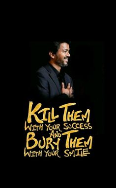 a man in a suit and tie with his arms folded, saying kill them with your success and burn them with your smile