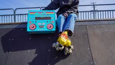 A skater sits on a ramp with their bunny hop package and skate box. Custom Skates, Skater Gifts, Kids Skates, Roller Skaters, Cup Art, Camping With Kids