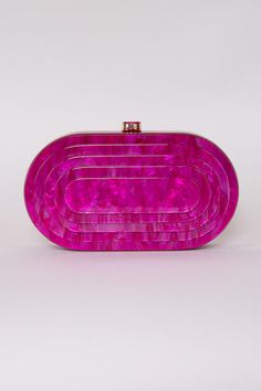 Prepare to inject a burst of color and excitement into your ensemble with the captivating Deco Clutch! Whether you're painting the town red for a night out or gracing a glamorous event, this clutch effortlessly infuses a hint of vintage charm into any attire. Acrylic 8.25" x 4.25" Hinged Closure Removeable Gold Chain Colors may vary with different viewing devices. Glamorous Pink Clutch For Events, Elegant Purple Clutch For Events, Elegant Purple Clutch For Event, Vintage Pink Clutch For Formal Occasions, Chic Pink Clutch For Formal Occasions, Chic Red Clutch For Events, Chic Pink Party Clutch, Trendy Pink Clutch For Events, Chic Purple Evening Clutch